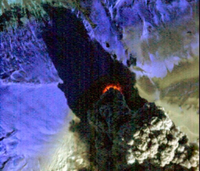 This false color infrared image acquired from the Hyperion instrument onboard NASA's Earth Observing-1 (EO-1) spacecraft and provided by NASA shows Iceland's Eyjafjallaj�kull volcano. The image reveals the intense thermal emissions (at least 60 megawatts, or 60 million watts) emanating from the vent at the base of the massive plume, center. This thermal emission, equivalent to the energy consumption of 60,000 homes, represents only a small proportion of the total energy being released by the volcano as its molten lava interacts violently with ice and water. (AP Photo)