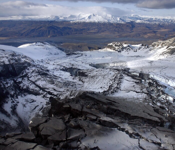 An aerial view of the glacier where the flood water, lower right, was flowing into the Markarfljot river from the glacier, volcanic eruption and the cracks in the Eyjafjallajokull glacier. The volcano in southern Iceland's Eyjafjallajokull glacier continued to send ash into the air. The Icelandic volcano that has kept much of Europe land-bound is far from finished spitting out its grit, and offered up new mini-eruptions that raise concerns about longer-term damage to world air travel and trade. (AP Photo)