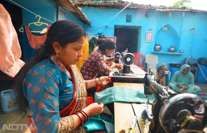 In Dakhinkuchi village near Subankhata, Assam, along the Indo-Bhutan border, women of the Birgwshri Fashion and Home Accessories Unit showcase Bodo Aronai-inspired bags and accessories at the 14th Indo-Bhutan Friendship Fair. Amid bustling stalls and cross-border visitors, participants like Sunita Baro, trained at the Grameen Vikas Manch TCPC funded by HDFC and powered by Usha, demonstrate how collective entrepreneurship bridges cultural ties, generates sustainable income, and empowers women in this harmonious yet opportunity-limited frontier.