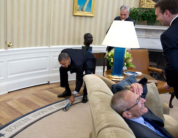 Barack Obama swats a fly that was invading his space in the Oval Office. <b>Photo Credit:</b> <a href=" http://www.whitehouse.gov/photos-and-video/2014-photos" rel="nofollow" target="_blank"><b>Pete Souza, Director and Chief Official White House Photographer</b></a>