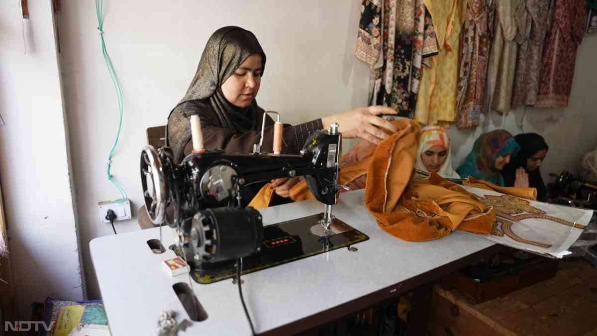 In Srinagar's Nowhatta, Marifat stands resilient in her boutique near Jamia Masjid, threading a needle with steady hands after her husband's sudden death in 2023 left her widowed with two young children. Through Usha Silai School's nine-day residential training via University of Kashmir's social work program, she transformed grief into grit-earning ?8,000-?15,000 monthly, stitching not just garments but her path to independence and self-respect.