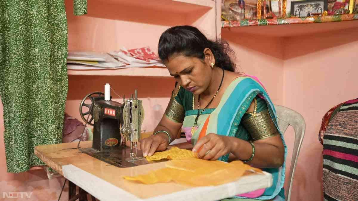 Near Ujjain in Kalukhedi village, Jyoti Khare, 37, operates her Usha Silai School from a modest corner of her home, demonstrating blouse stitching to eager trainees while wearing her mangalsutra as a shield against judgment. Married at 14 and divorced in 2012 after years of abuse, her 2023 nine-day training turned survival gigs-like e-rickshaw driving and cooking-into a stable enterprise training villagers and fulfilling her dream of city expansion.