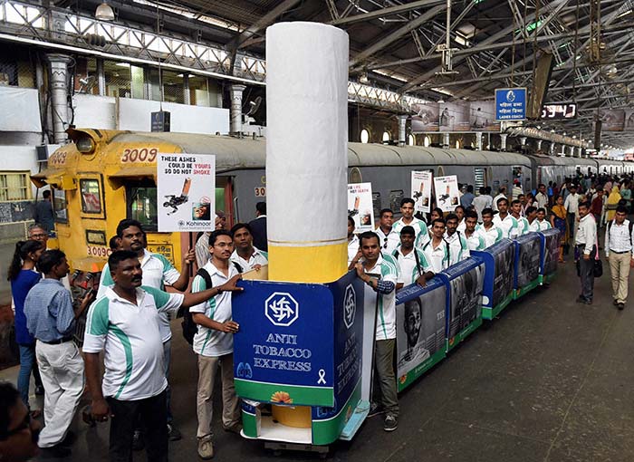 People display a dummy train to demonstrate diffrent stages of cancer on the eve of World Anti Tobacco Day in Mumbai. (PTI)