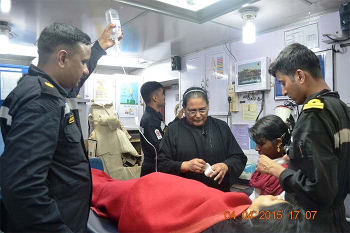 Naval officers help an on-board doctor to attend to a pregnant lady on the INS Mumbai. The Indian Navy is carrying out massive rescue and evacuation operations in the Gulf of Aden. Around 250 Indians are said to be stranded in Yemen's Aden. Photo Courtesy: Indian Navy