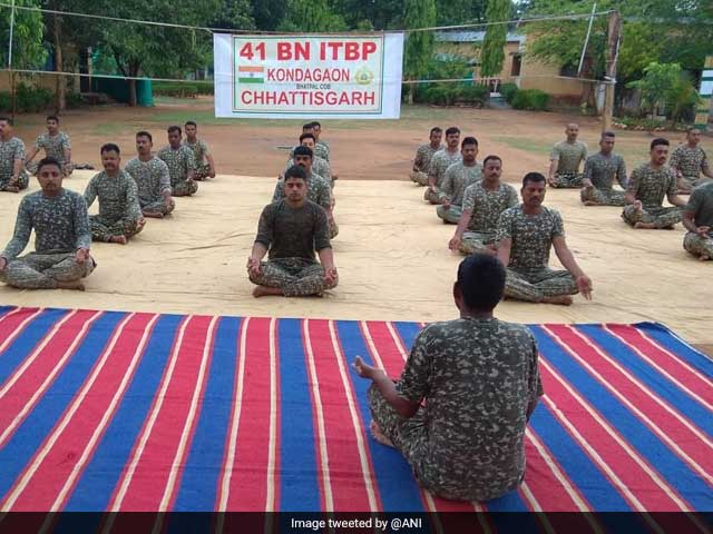 Indo-Tibetan Border Police personnel deployed in Chhattisgarh perform yoga on International Day of Yoga.