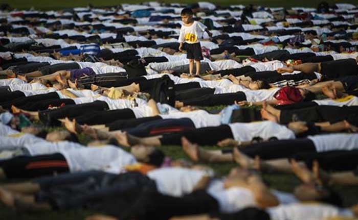 A Malaysian boy is seen playing during the International Day of Yoga festival in Kuala Lumpur, Malaysia