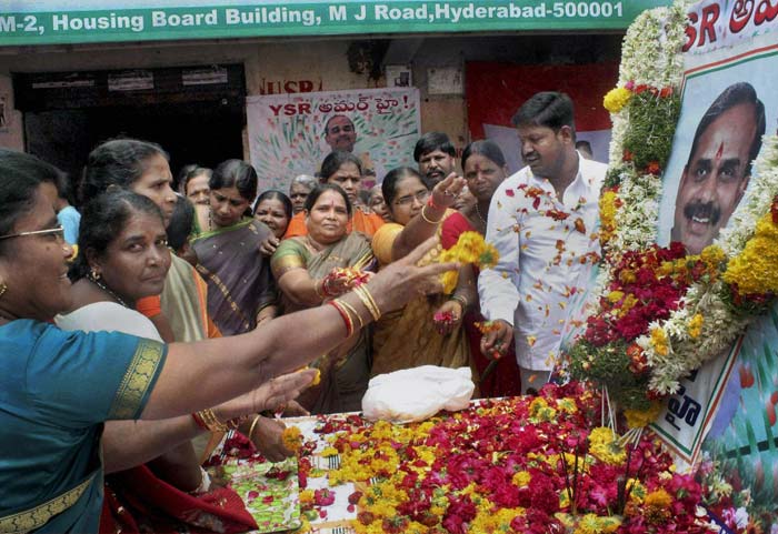 In this photo, women supporters are seen paying tributes to YSR on his birth anniversary in Hyderabad. PTI Photo