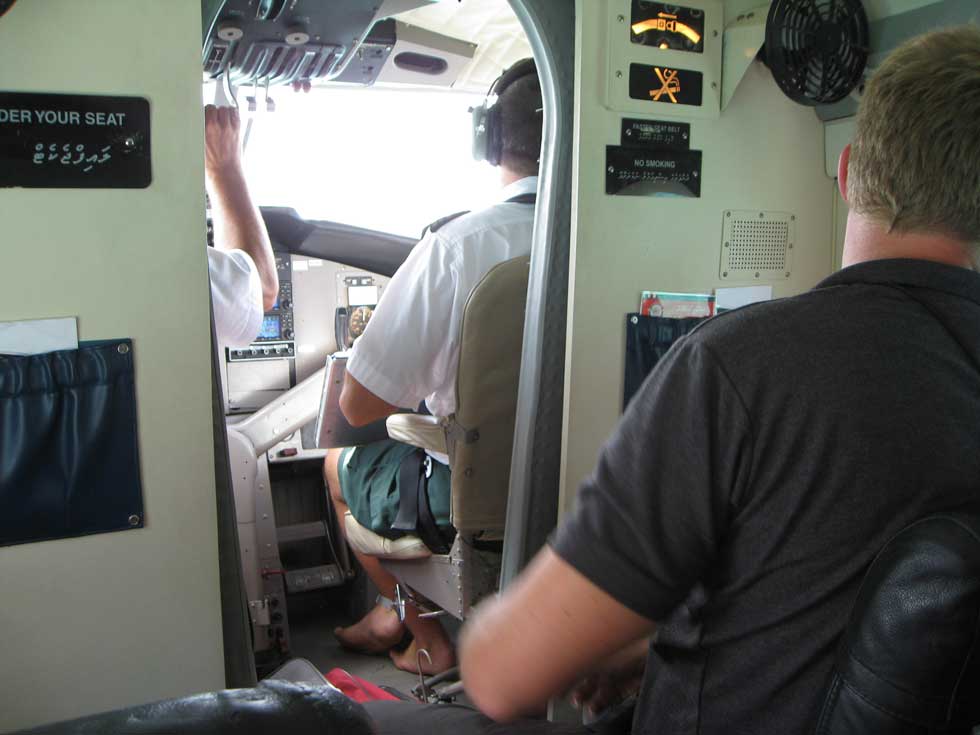 The pilots wearing shorts and beach slippers get ready to take off.