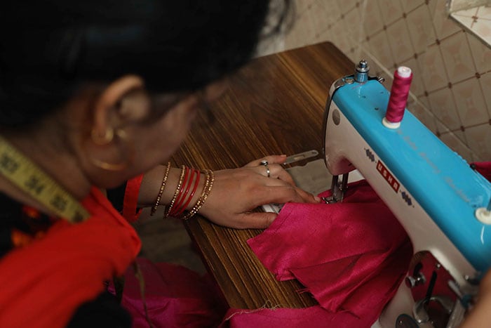 Now, financial stable, Rubina has mastered the skill of sewing and carpet making. She is passing on her skills and knowledge to other village women.