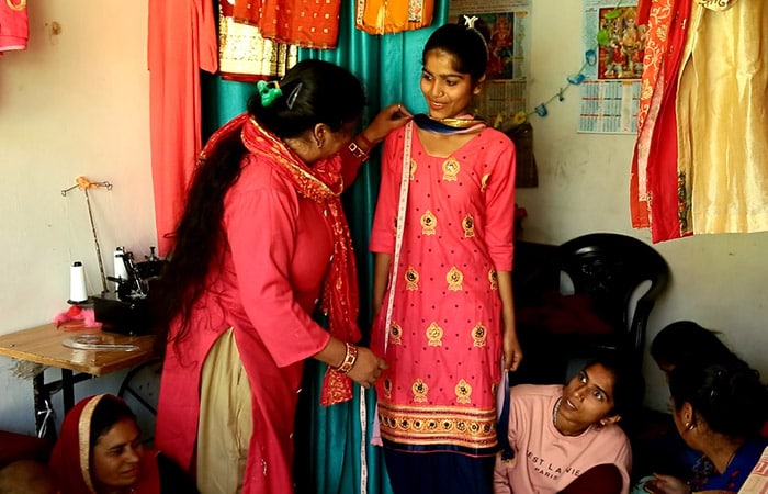 There were many struggles in the life of Sandna Devi, before she could make a name for herself.  She sought help from many people during time of her struggles, but it was her meeting with the head of the panchayat that proved to be the turning point in her life as he introduced her to the Silai School initiative.