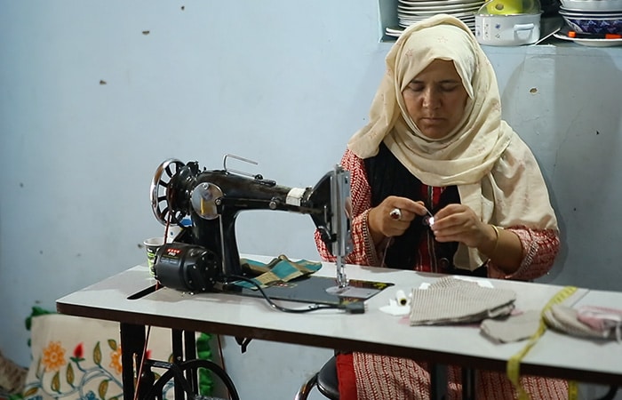 Zara Bano, a resident of Chuchot Bangapa Leh, is one of the women artisans who produce some of the finest Pashmina in the world but did not have access to right market to sell her handmade products. After she got to know about USHA Silai School programme from Looms of Ladakh, Zara enrolled herself for a 10 days training and has now opened her own Silai School and is looking forward to selling finished garments made by her.