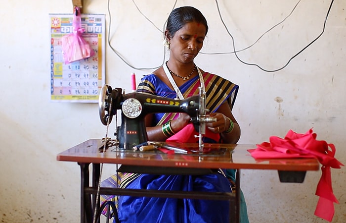 Bharti Kaislash Jadhav, a 30-year-old woman is a beneficiary of USHA-TCF collaboration. She and her family were facing financial struggles and putting food on the table every day became a challenge for them. But a sewing machine has made a difference to her life. She is able to earn Rs. 4,000 every month working from home now out of which she saves Rs. 1,000 per month. While talking to NDTV she said, 'There is a lot of poverty in my village. We could not even take care of our kids as we were out the whole day for work. But with help of USHA Silai School, I am able to earn from home itself. I am able to stitch a lot of things and I also know machine repair work now. This has helped me and my husband a lot and we are now able to get some important renovations done for our house.'