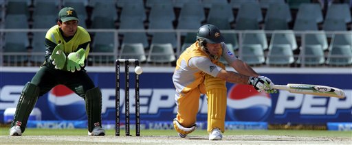 Australia's captain Ricky Ponting, right, misses a shot as Pakistan's wicketkeeper Kamran Akmal, left, looks on during their Super Eight's of their Twenty20 World Championship cricket match against Pakistan at the Wanderers Stadium in Johannesburg, South Africa, Tuesday, Sept. 18, 2007. Australia vs Pakistan