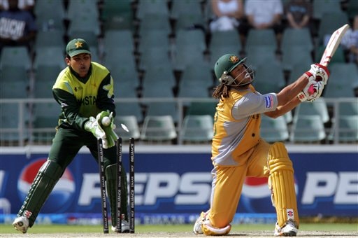 Australia's batsman Andrew Symonds is bowled by Pakistan's bowler Shahid Afridi, not pictured, for 29 runs as Pakistan's wicketkeeper, Kamran Akmal, catches the ball during their Super Eight match of the World Twenty20 cricket tournament at the Wanderers Stadium, Johannesburg, South Africa, Tuesday, Sept. 18, 2007. Australia vs Pakistan