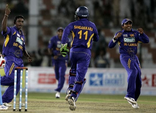 Ajanta Mendis, extreme left, celebrates after dismissing Rohit Sharma, unseen, in the Asia Cup final. Final - India vs Sri Lanka