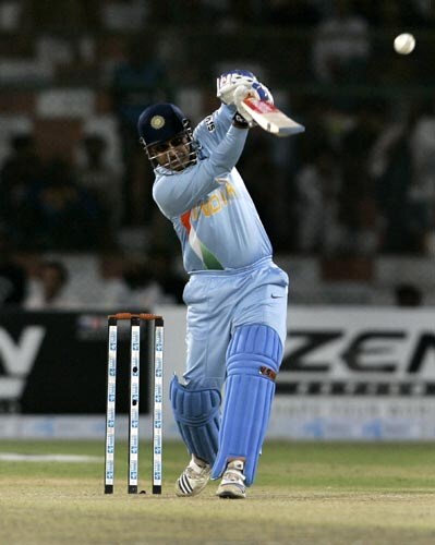 Virender Sehwag hits a boundary against Sri Lanka in the Asia Cup final. Final - India vs Sri Lanka