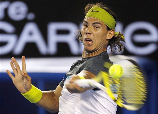 Spain's Rafael Nadal returns the ball to Belgium's Christophe Rochus in a men's singles match at the Australian Open in Melbourne on Tuesday. (AP Photo) Australian Open Day 2