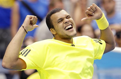 France's Jo-Wilfried Tsonga celebrates after beating Argentina's Juan Monaco during their men's singles match at the Australian Open on Tuesday. (AP Photo) Australian Open Day 2