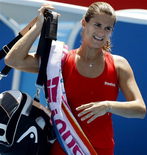 France's Amelie Mauresmo walks off the court after defeating Beralus' Olga Govortsova during a women's singles match at the Australian Open on Tuesday. (AP Photo) Australian Open Day 2