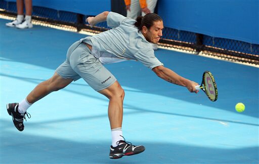 Argentina's Guillermo Canas stretches for a return to Germany's Dieter Kindlmann during their men's singles match at the Australian Open on Tuesday. (AP Photo) Australian Open Day 2