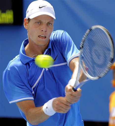 Czech Republic's Tomas Berdych returns to Argentina's Brian Dabul during their men's singles match at the Australian Open in Melbourne. Australian Open Day 3