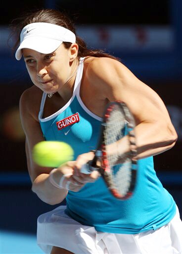 France's Marion Bartoli makes a return to Serbia's Jelena Jankovic during their women's singles match at the Australian Open in Melbourne on Sunday. (AP Photo) Australian Open Day 7