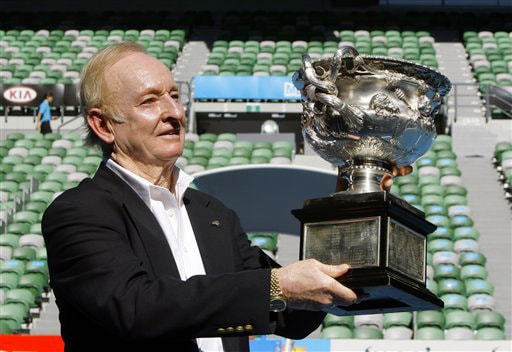 Tennis legend Rod Laver of Australia holds the men's singles trophy as he stands on Rod Laver Arena during a photocall at the Australian Open in Melbourne on Wednesday. It's the 40th anniversary of Laver's second Grand Slam of singles titles in 1969. (AP Photo) Australian Open Day 10
