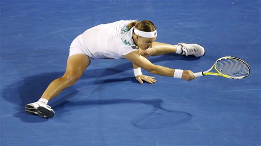 Russia's Svetlana Kuznetsova does the spilts as she makes a return to Serena Williams of the United States during a women's singles quarterfinal match at the Australian Open in Melbourne on Wednesday. (AP Photo) Australian Open Day 10