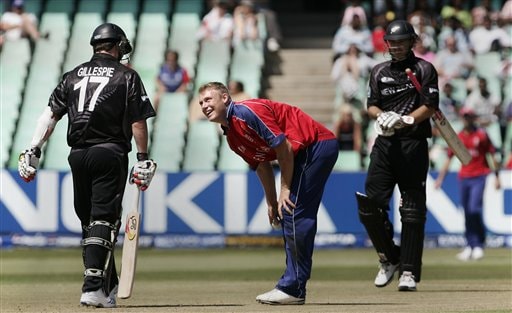 England's Andrew Flintoff, center, shares a moment with New Zealand's Mark Gillespie, left, during their Twenty20 World Championship Cricket match in Durban, South Africa, Tuesday, Sept. 18, 2007. England vs New Zealand