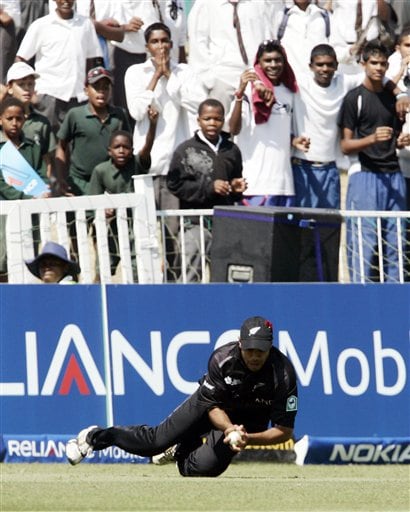 New Zealand's Jeetan Patel takes a successful catch for the dismissal of England's Dimitri Mascarenhas during their Twenty20 World Championship Cricket match in Durban, South Africa, Tuesday, Sept. 18, 2007. England vs New Zealand