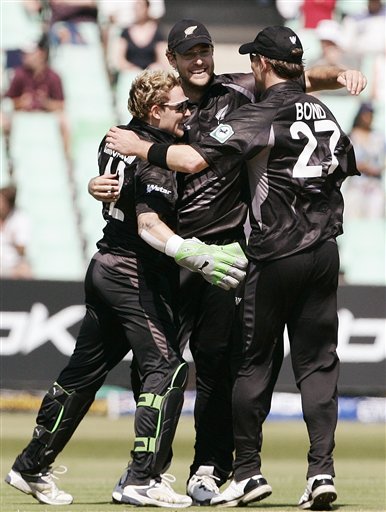 New Zealand's Daniel Vettori, center, Brendon McCullum, left and Shane Bond celebrate their teams victory over England during their Twenty20 World Championship Cricket match in Durban, South Africa, Tuesday, Sept. 18, 2007. England vs New Zealand