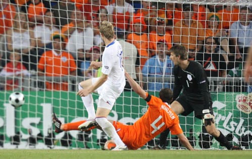 Russia's Roman Pavlyuchenko, left, scores the opening goal during the quarterfinal match between the Netherlands and Russia in Basel, Switzerland. Netherlands vs Russia