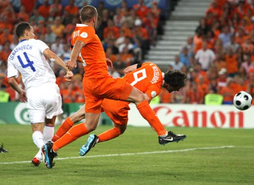 Netherlands' Ruud van Nistelrooy, right, scores on a header during the quarterfinal match between the Netherlands and Russia in Basel, Switzerland. Netherlands vs Russia