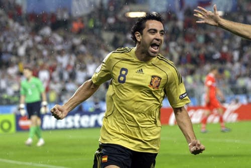 Spain's Xavi Hernandez celebrates after scoring his side's opening goal during the semifinal match between Russia and Spain in Vienna, Austria. 2nd Semifinal - Russia vs Spain