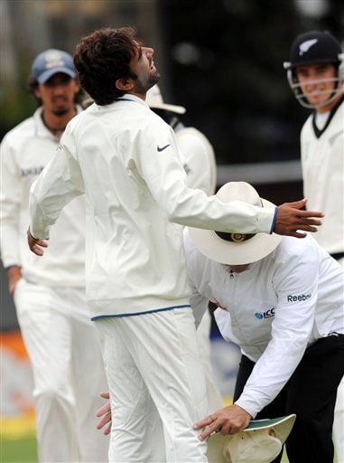 Umpire Daryl Hare does a body search of India's fast bowler Munaf Patel after the match ball went missing after the lunch break against New Zealand on the 5th day of the 3rd Test at Basin Reserve in Wellington on Tuesday. (AP Photo) India vs NZ: 3rd Test, Day 5