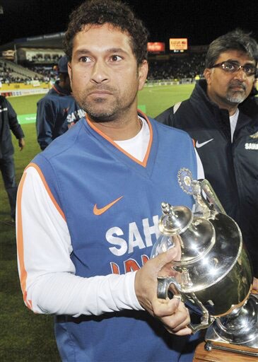 Sachin Tendulkar holds the trophy after his team's 3-1 ODI series win over New Zealand at Auckland on Saturday. (AP Photo) India win ODI series 3-1