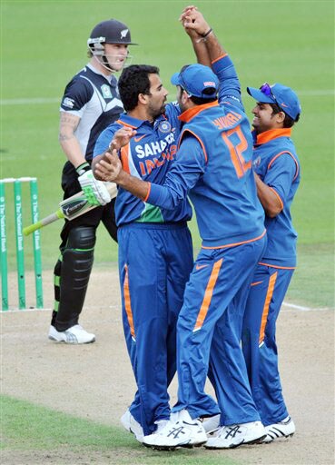 Zaheer Khan celebrates with Yuvraj Singh and Suresh Raina after taking the wicket of Brendon McCUllumin in the 4th ODI at Hamilton. (AP Photo) India vs New Zealand: 4th ODI