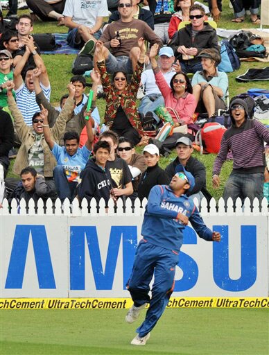 Rohit Sharma celebrates taking the catch to dismiss Ross Taylor for 5 off the bowling of Yusuf Pathan in the 4th ODI at Hamilton on Wednesday. (AP Photo) India vs New Zealand: 4th ODI