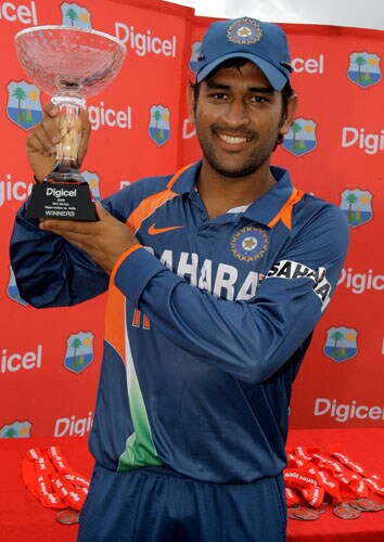 Mahendra Singh Dhoni poses with the trophy after his team won the One-Day International series against the West Indies at Beausejour Cricket Ground in St. Lucia. (AP Photo) India win ODI series in WI