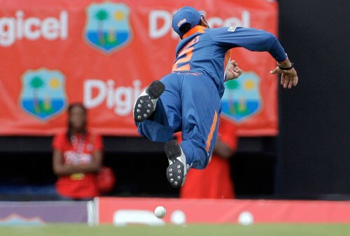 Yuvraj Singh dives but fails to catch a shot off West Indies' opener Runako Morton during the fourth and final One-Day International match at Beausejour in St. Lucia. (AP Photo) India win ODI series in WI