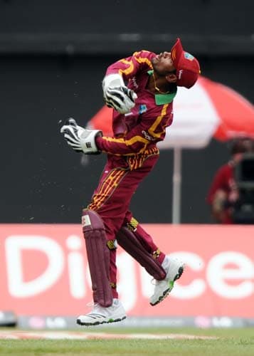 Denesh Ramdin celebrates after taking a catch to dismiss Yuvraj Singh during the first ODI against India at the Sabina Park. (AFP Photo) 1st ODI: IND vs WI