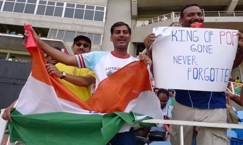 Indian fans cheer their team and display a sign to pay tribute to late music star Michael Jackson during the first ODI between India and the West Indies at Sabina Park. (AP Photo) 1st ODI: IND vs WI