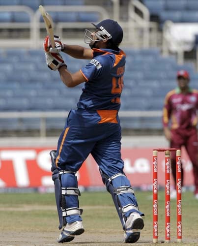 Rohit Sharma watches his shot before before being caught by Dwayne Bravo during their first ODI aginst the West Indies at Sabina Park. (AP Photo) 1st ODI: IND vs WI