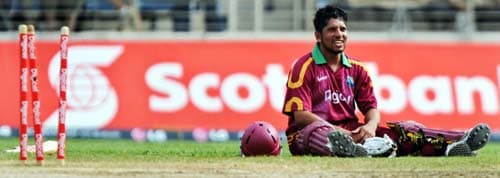 Ramnaresh Sarwan reacts after being run out during the first ODI against India at the Sabina Park. (AFP Photo) 1st ODI: IND vs WI