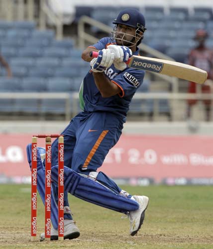 Mahendra Singh Dhoni drives for the boundary during the first ODI against the West Indies at Sabina Park. (AP Photo) 1st ODI: IND vs WI
