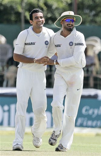 Zaheer Khan, left, celebrates the dismissal of Sri Lankan batsman Thilan Samaraweera, unseen, with teammate Harbhajan Singh during the third day's play of the first Test cricket match between Sri Lanka and India in Colombo on Friday, July 25, 2008. India vs SL, 1st Test, Day 3