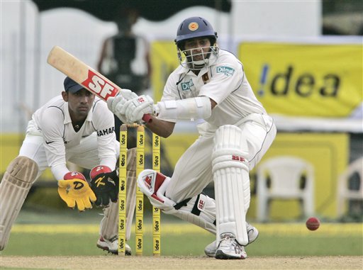 Thilakaratne Dilshan bats as Dinesh Karthik looks on during the third day's play of the first Test cricket match between Sri Lanka and India in Colombo on Friday, July 25, 2008. India vs SL, 1st Test, Day 3