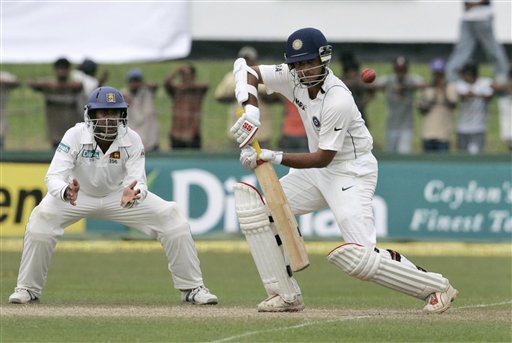 Sourav Ganguly plays a shot as Sri Lankan fielder Malinda Warnapura, left, looks on during the third day's play of the first cricket Test between Sri Lanka and India in Colombo on Friday, July 25, 2008. India vs SL, 1st Test, Day 3