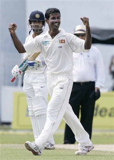 Nuwan Kulasekera celebrates the wicket of Virender Shewag, unseen, as India's non striker Gautam Gambhir looks on during the third day's play of the first cricket Test match between Sri Lanka and India in Colombo on Friday, July 25, 2008. India vs SL, 1st Test, Day 3