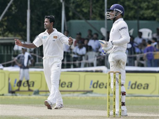 Nuwan Kulasekera, left, celebrates the wicket of Virender Sehwag during the third day's play of the first Test cricket match between Sri Lanka and India in Colombo on Friday, July 25, 2008. India vs SL, 1st Test, Day 3